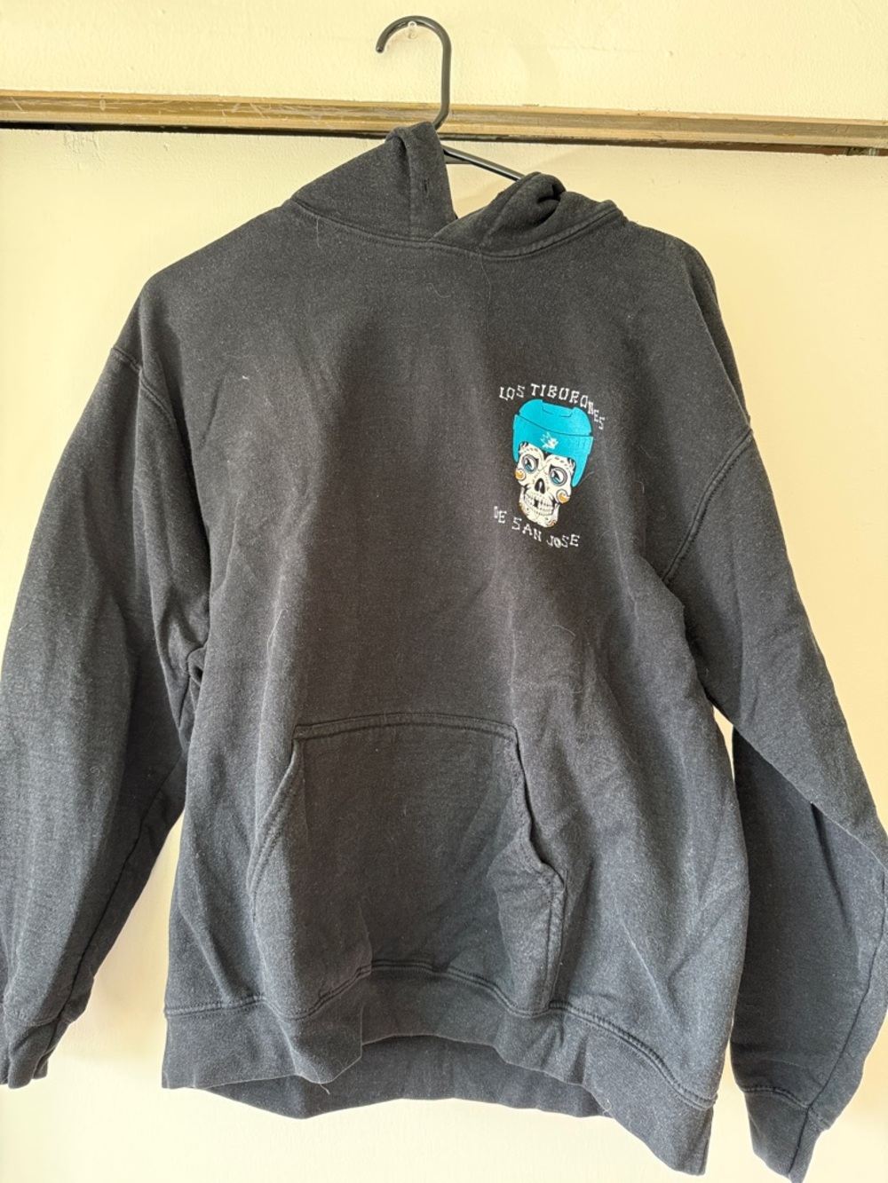 San Jose Sharks/ Los Tiburones Black Pullover Hoodie with Teal Skull Graphic